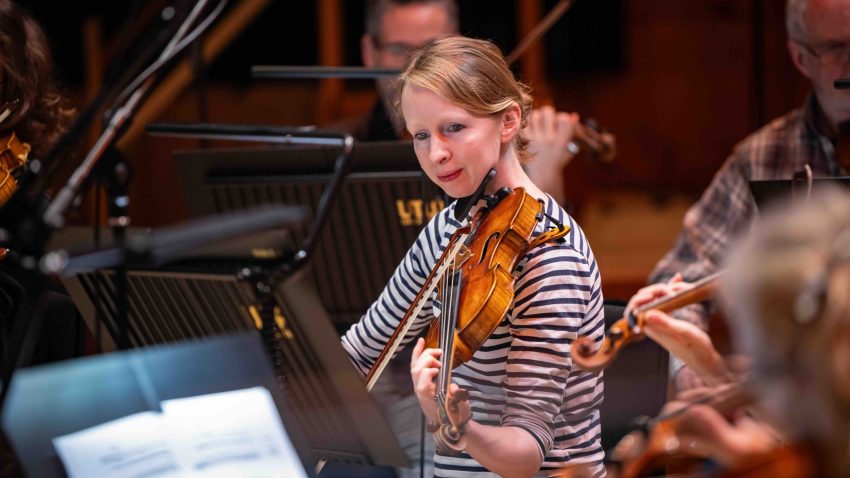 Woman plays the violin.