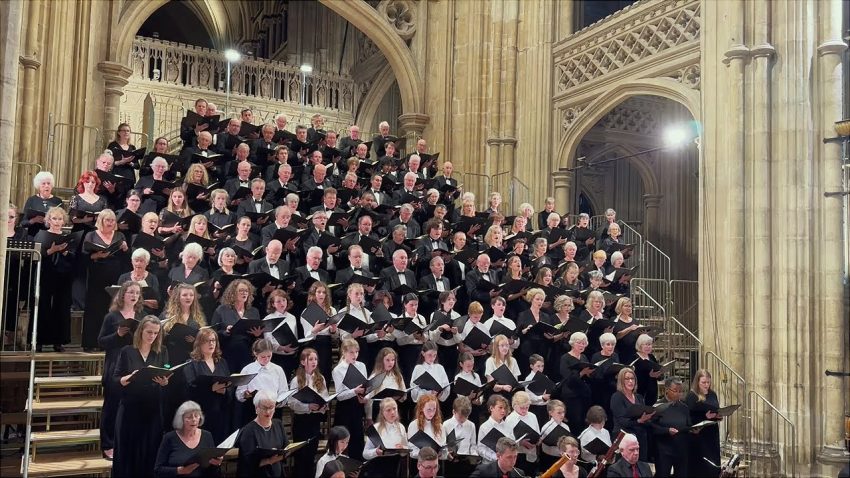 A choir arranged in tiered rows.