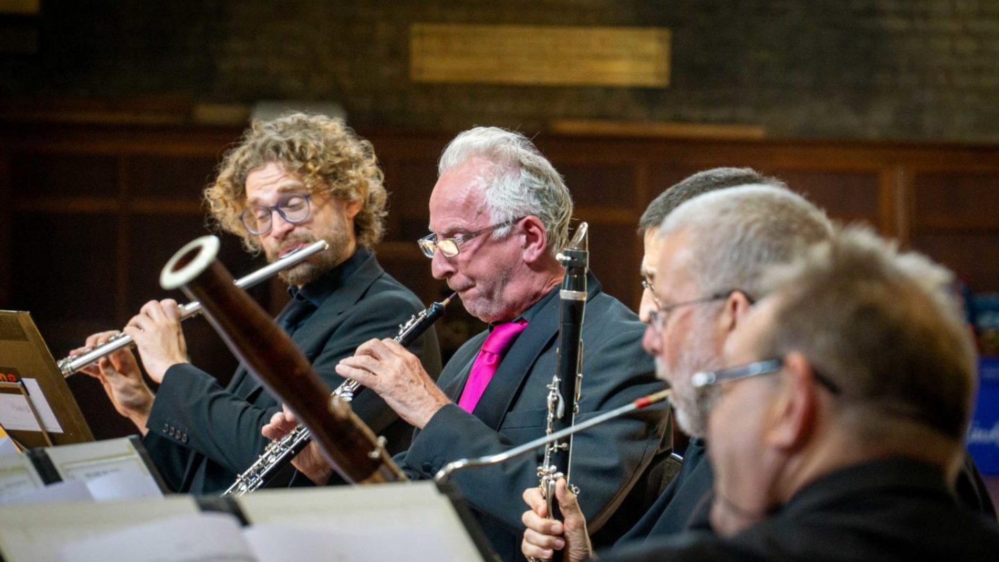 Members of the wind section performing.