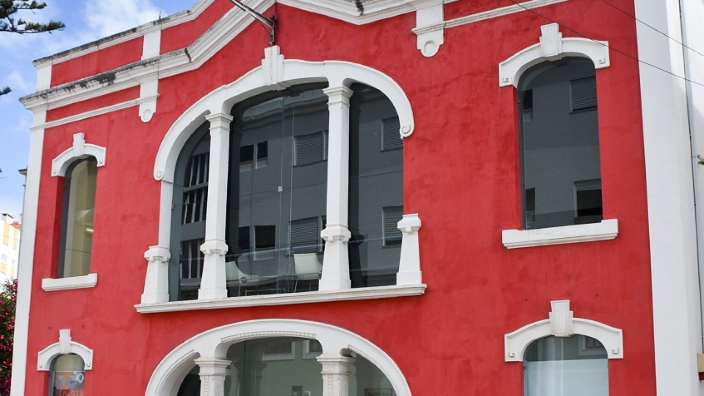 Beautiful Portuguese building with red walls.